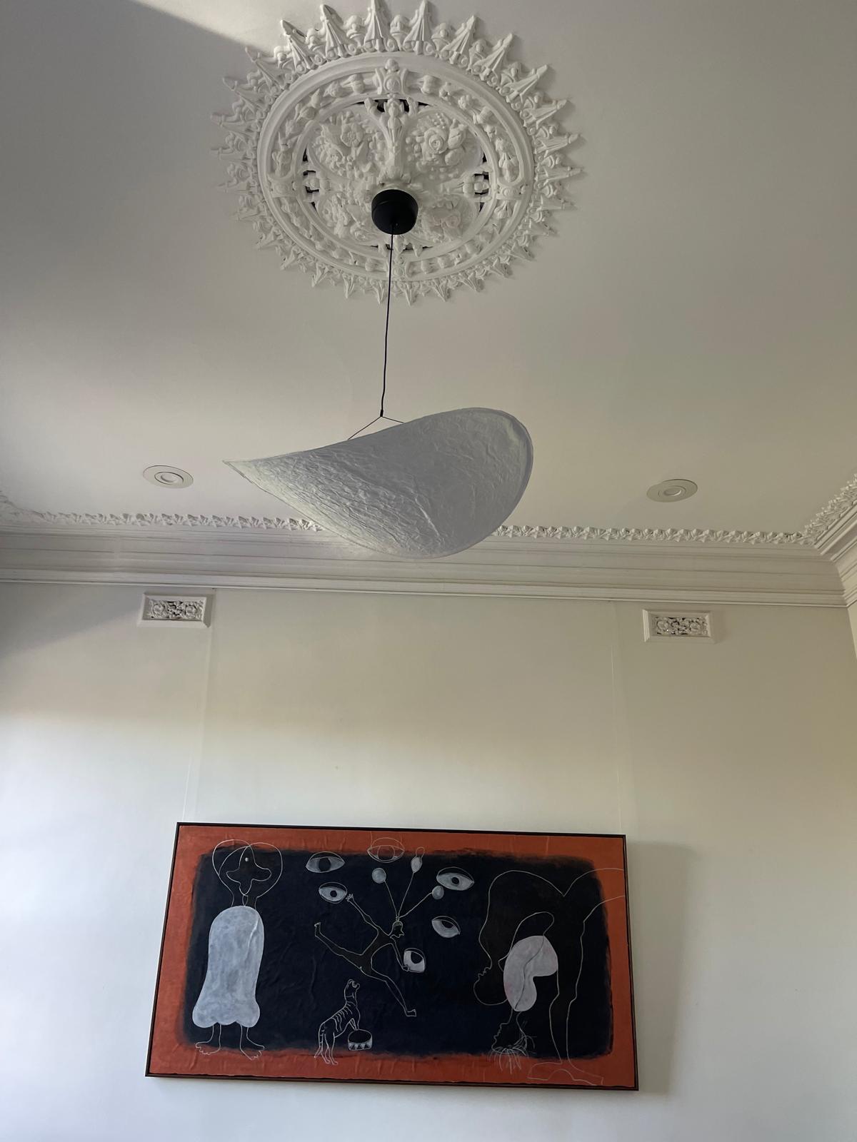 Pendant light beneath an ornate heritage ceiling rose in a Fitzroy North home